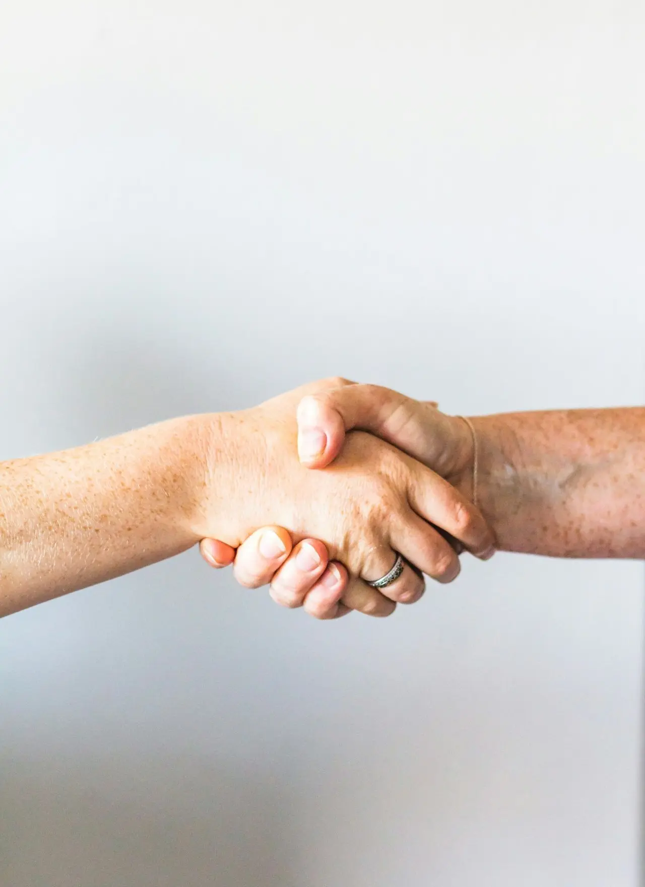 person holding hands of another person